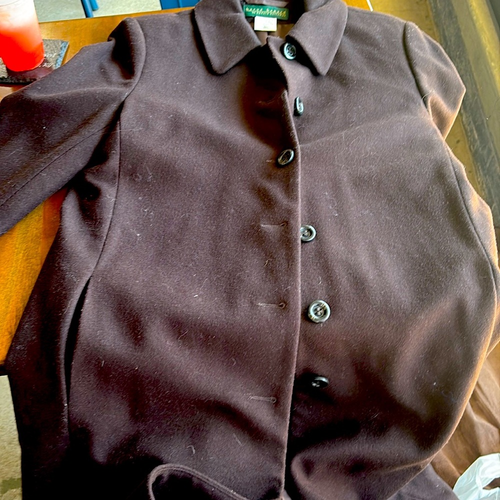 A brown knee length trench coat